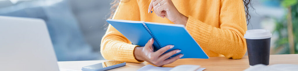 a woman looks at her data and analyzes how much does marketing cost