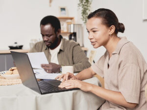 a male business owner and a female business owner are writing local content