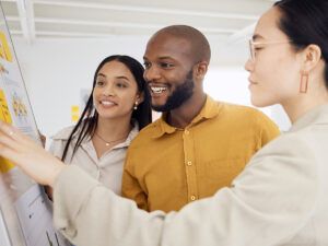 a team in a small business discussing their findings after competitors keyword research