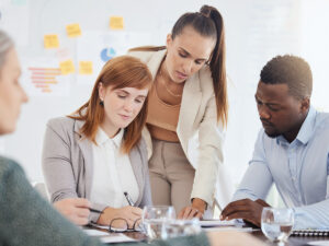 an ongoing meeting of a team in a small business for how to define content marketing strategy