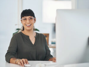 a small business owner getting ready to write web copy in her computer