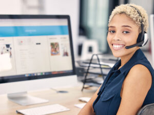 a smiling e-commerce marketing employee researching about ecommerce marketing strategies