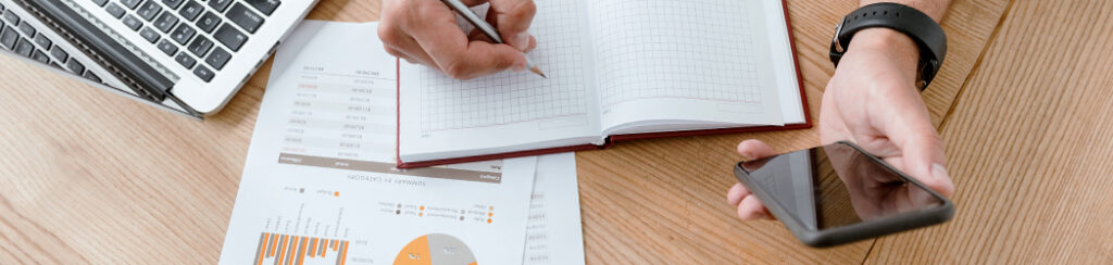 small business owner looking through digital marketing statistics while coming up with a marketing strategy