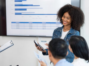 They discuss target marketing budget in their small business team meeting