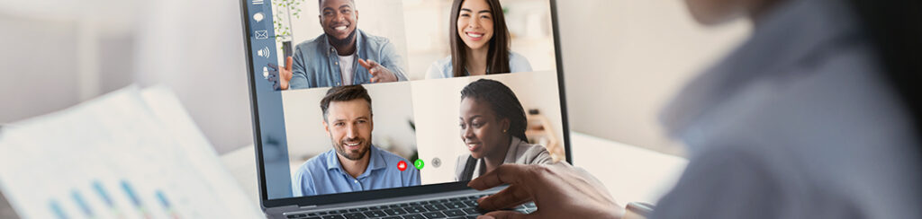 Person using a laptop for a video conference call on calculating return on marketing spend.
