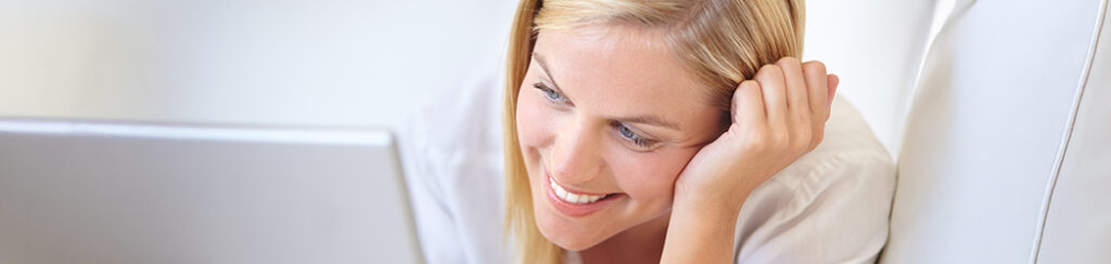 A woman researches learning how to convert a blog reader to a customer.