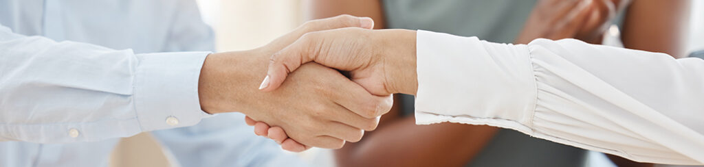They shake hands after a successful business collaboration, showcasing the importance of reviews for local SEO success.