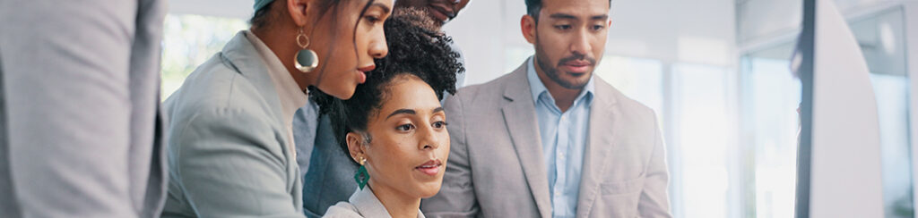 Business team reviews plans for hiring a marketing agency.