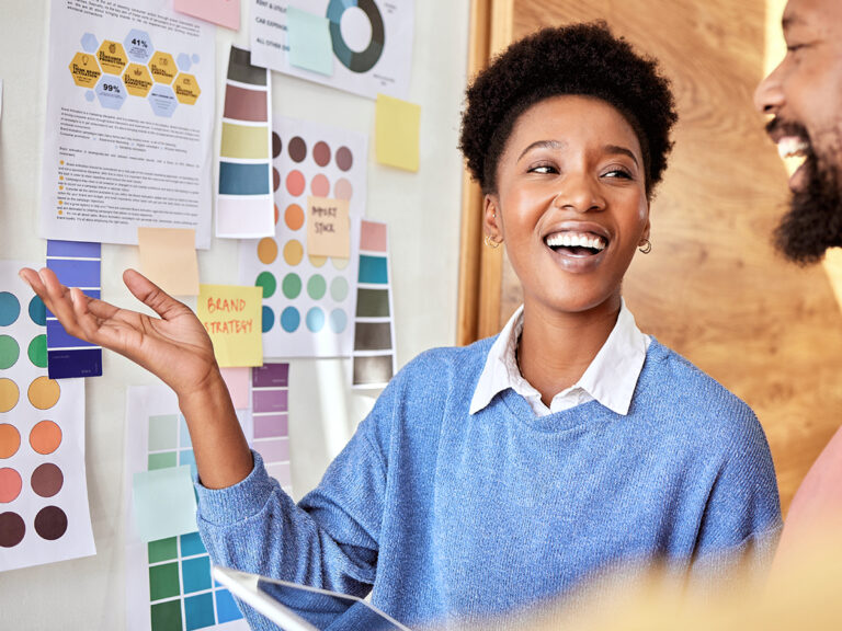 Small business in-house designer discusses how to create a brand identity with a colleague