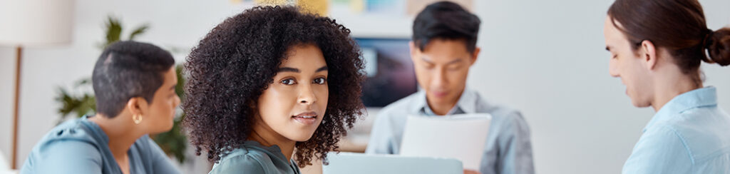 Small business team discussing finding competitors' keywords in a team meeting