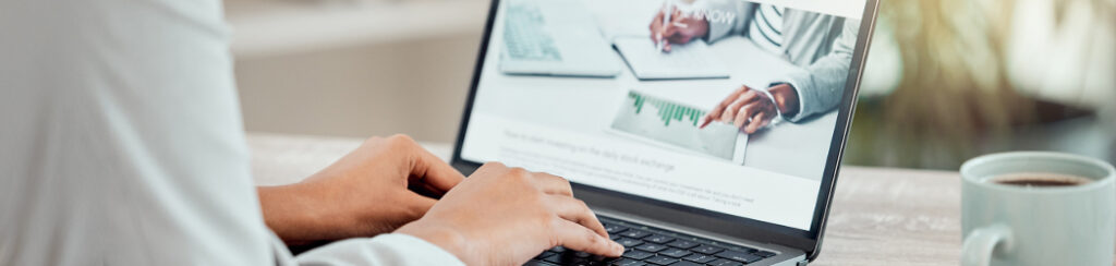 Person typing on a laptop with local SEO landing pages open