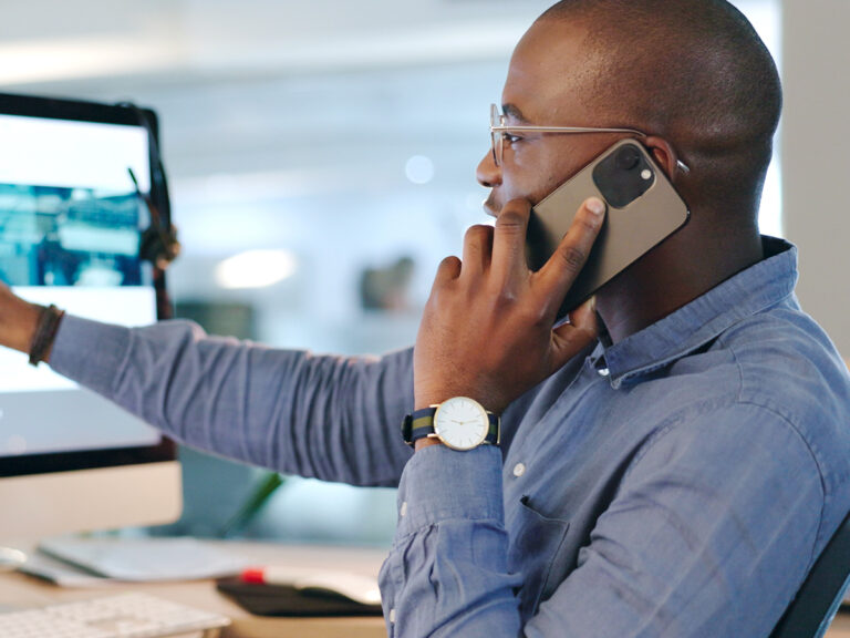 Man wearing glasses discusses SEO for Google My Business while pointing at a website page.