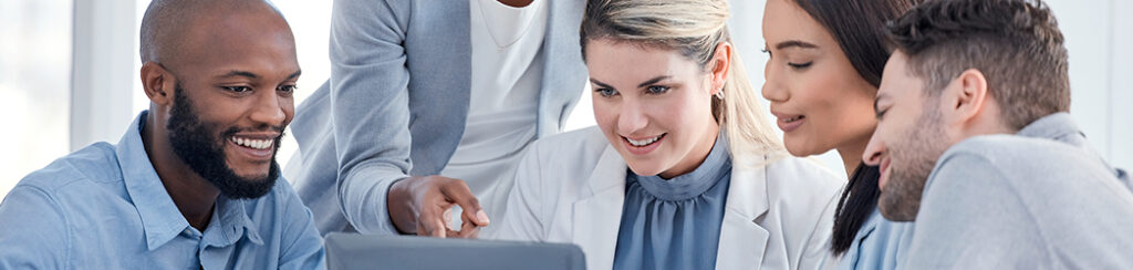 Five people collaborate around a laptop, discussing strategies with a marketing integrator