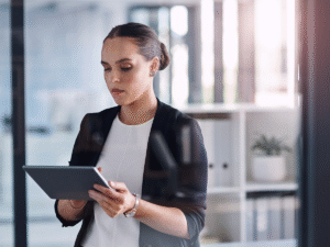 Woman using a tablet viewing a website call to action on a business page.