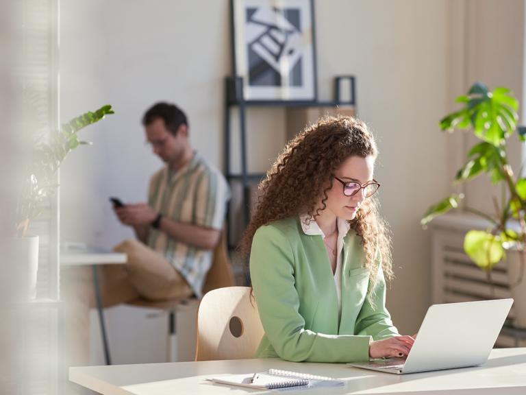 Small business owner creating Google posts to improve local search visibility.