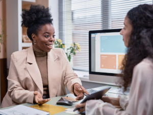 Small business owner discussing seasonal SEO strategy with a marketing consultant.